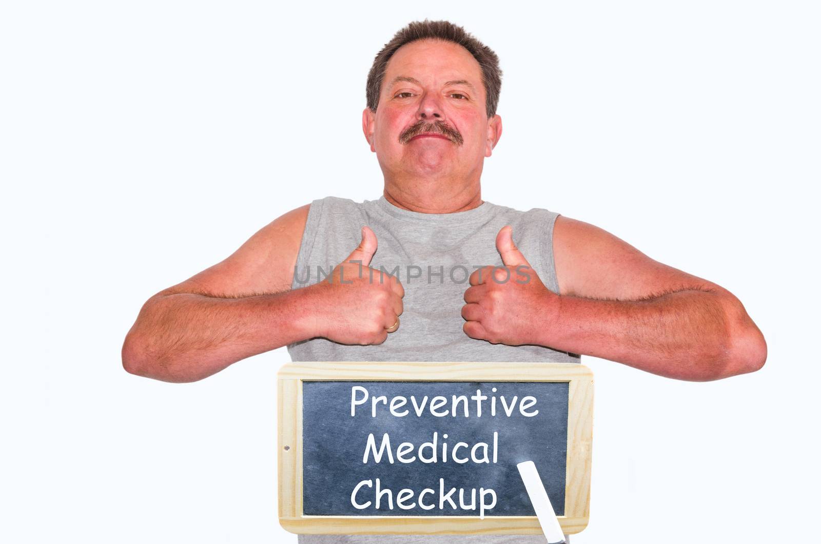 Thumbs up! man shows two thumbs up. Underneath a chalkboard with inscription Preventive medical checkup on white background