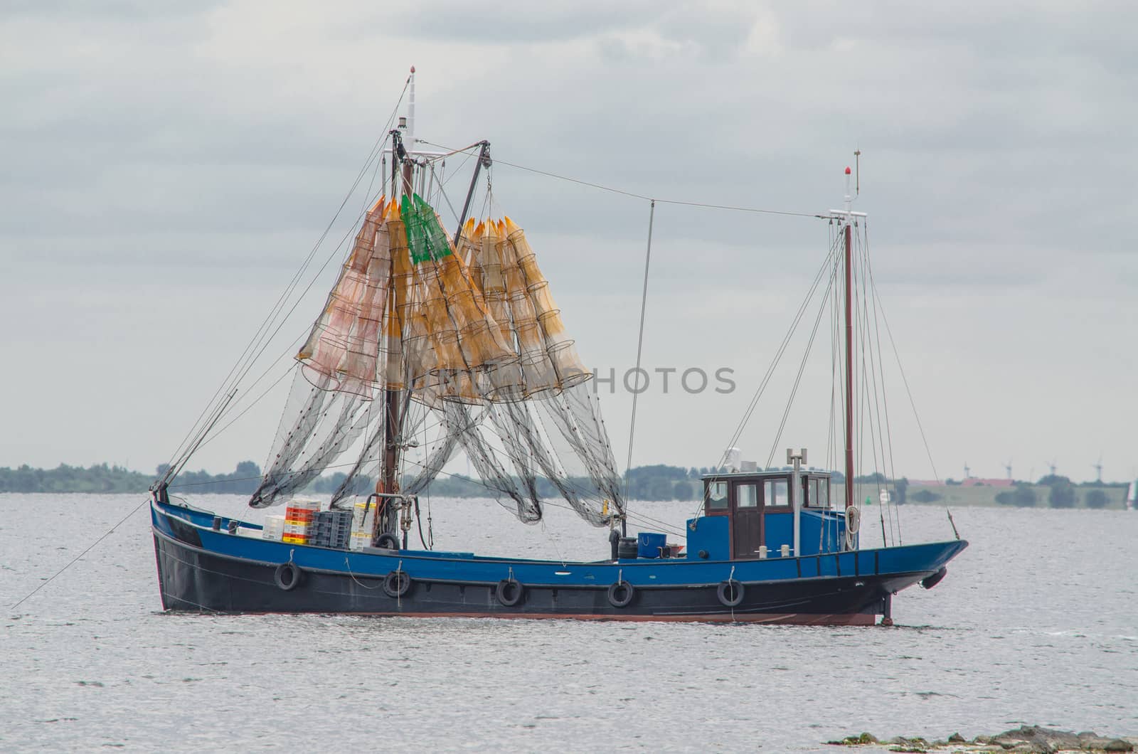 Fishing boat on the Grevelingenmeer in Holland. Shot at dusk.