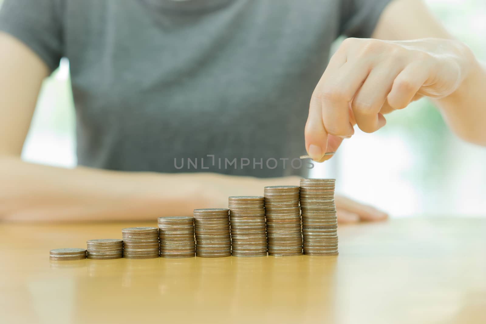 women put coin stack money for money growth concept