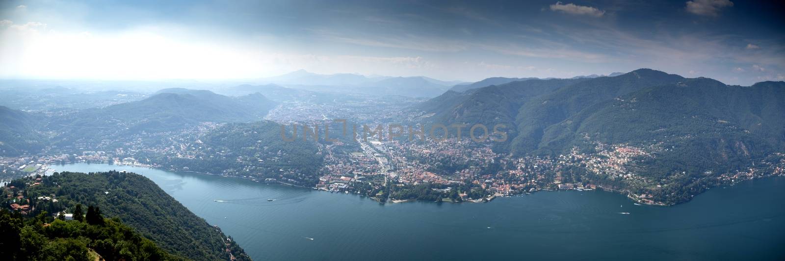 Como lake landscape with boats and water in summer travel