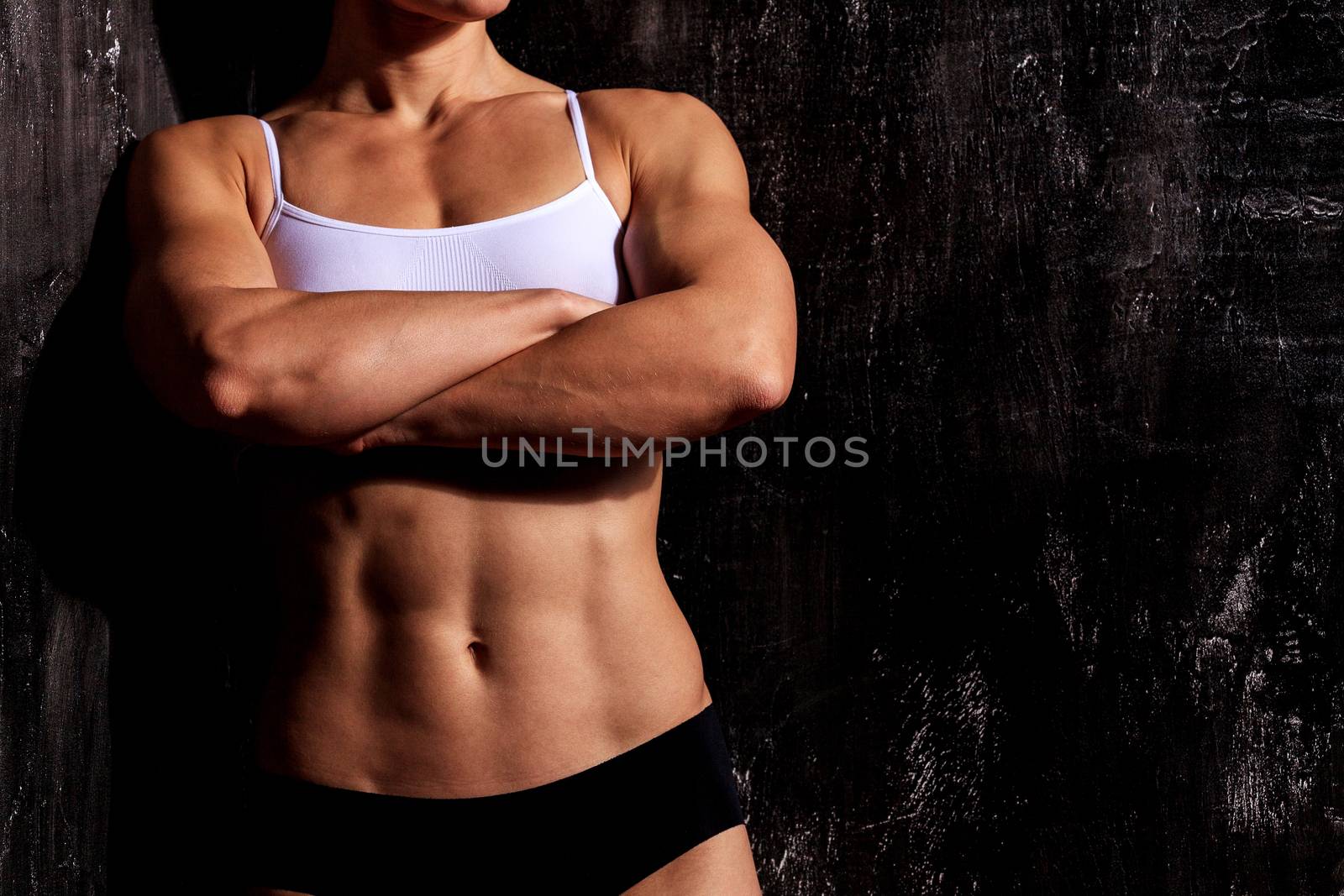 Strong woman on a dark background