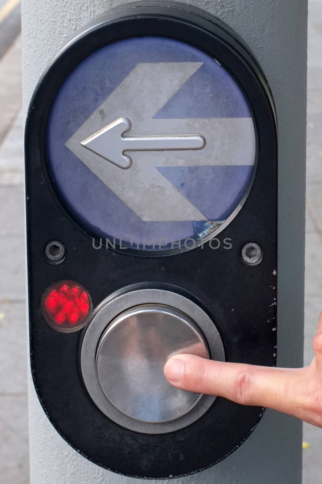 Arrow and button to press for Pedestrian Crossing