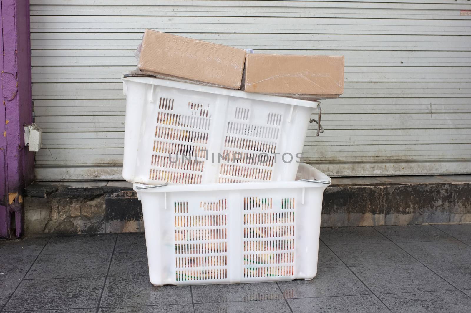 Pile of white plastic basket and paper box