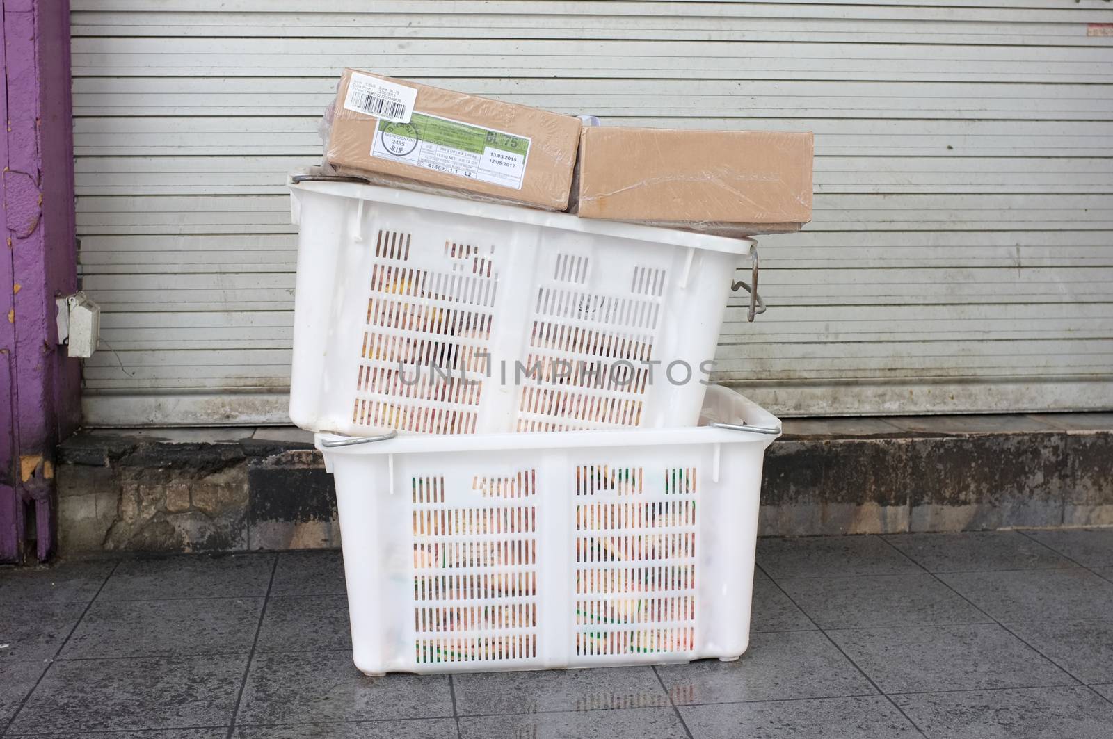 Pile of white plastic basket and paper boxPile of white plastic basket and paper box