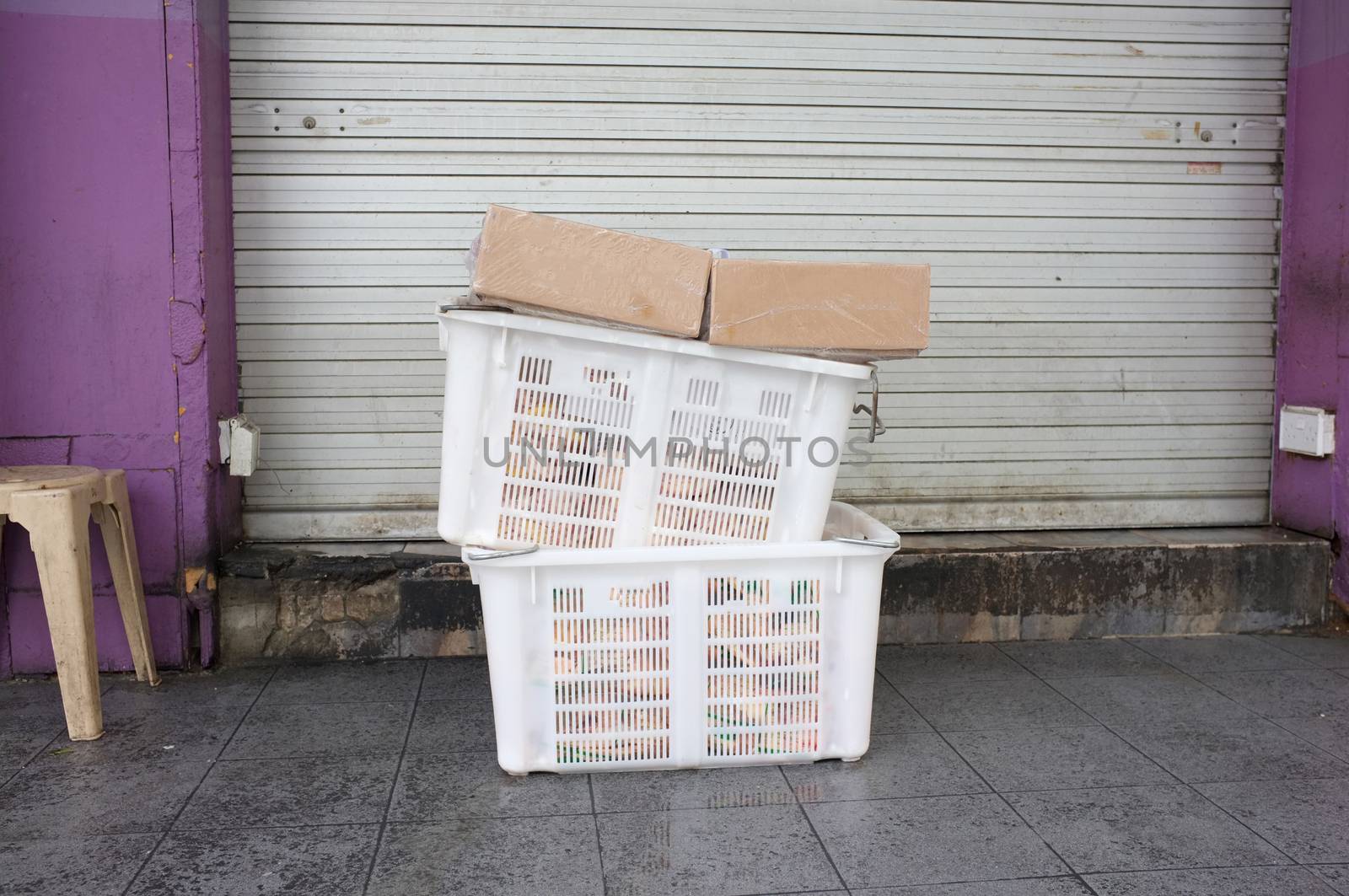 Pile of white plastic basket and paper box