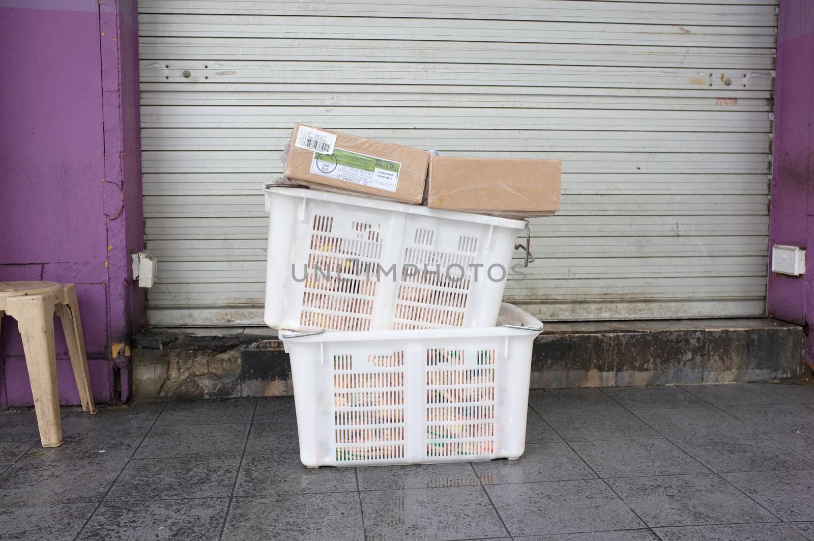 Pile of white plastic basket and paper boxPile of white plastic basket and paper box
