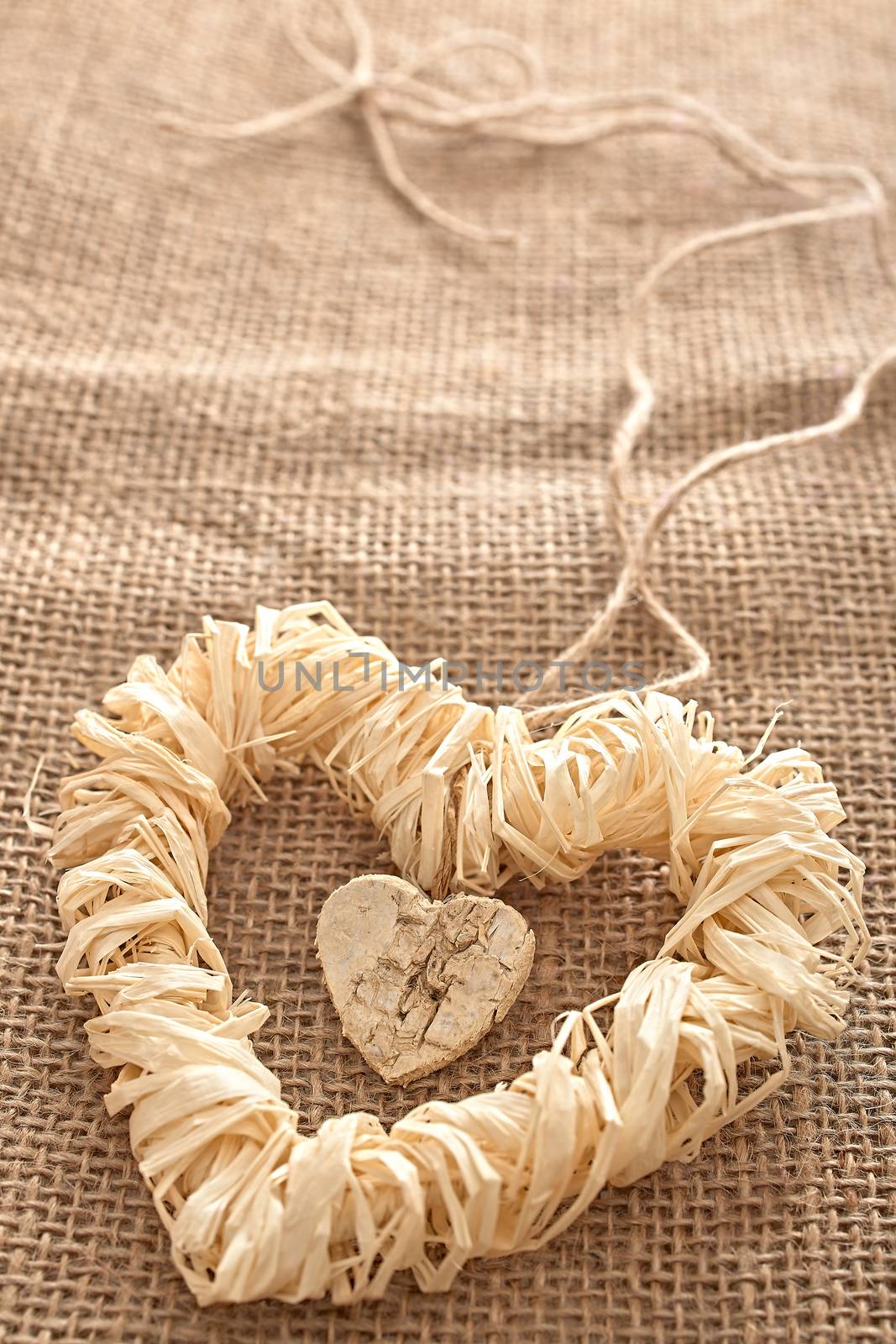 Love hearts, Valentines Day. Heart handmade, made of bark and straw, decoration.  Vintage romantic style, sackcloth background, creative unusual greeting card, copyspace