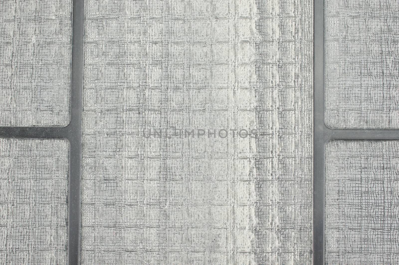 Accumulation dust on filter of air purifier put on table use as texture or background.