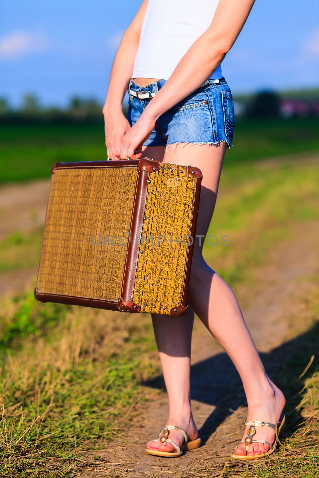 Woman with big old suitcase by Nobilior