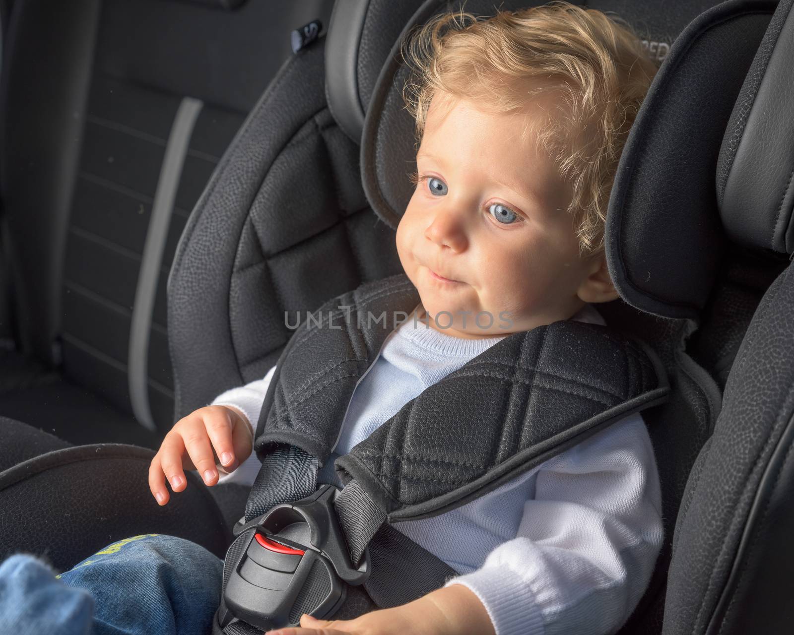 Infant boy in a safety car seat by Robertobinetti70