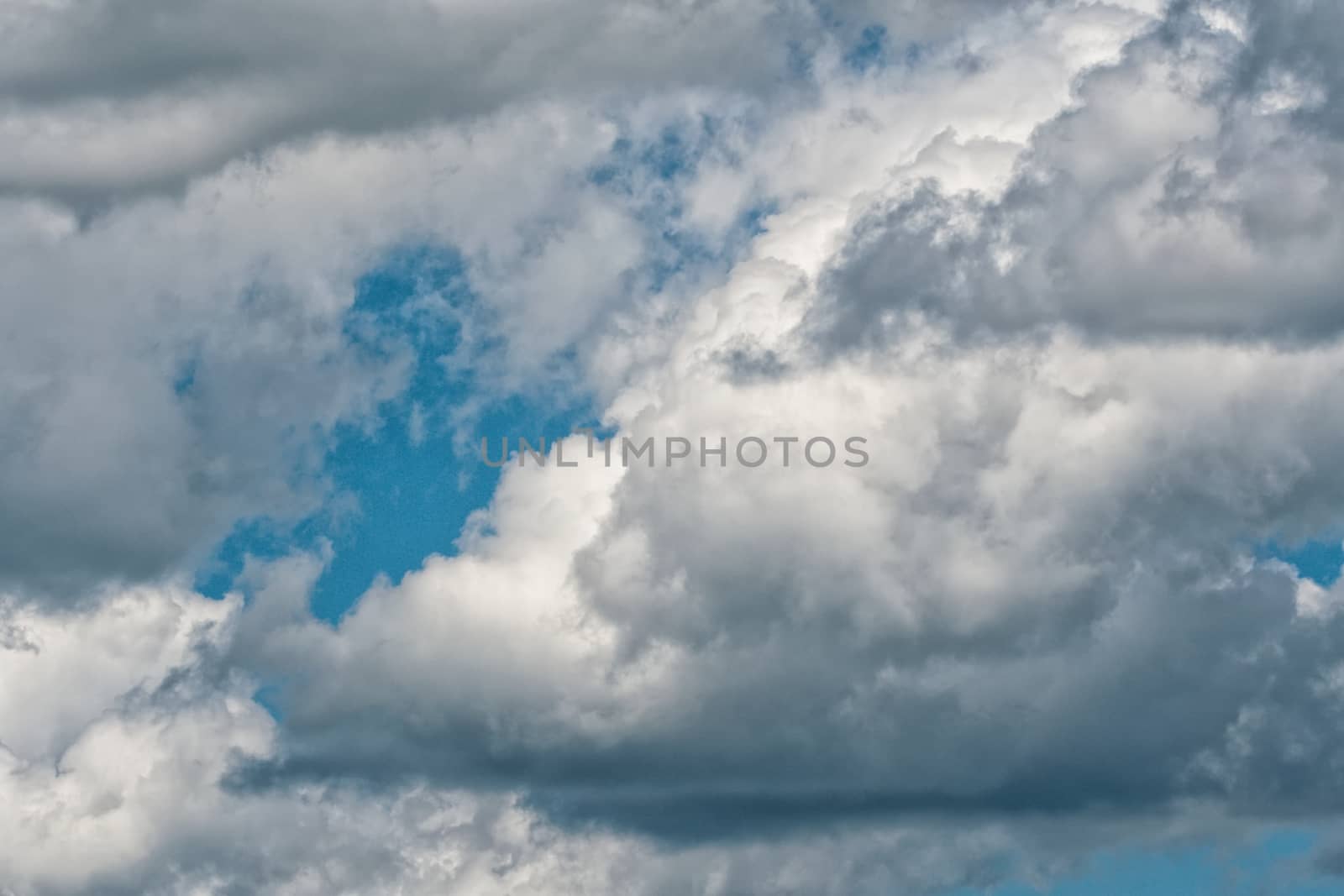 Blue sky background with a tiny clouds