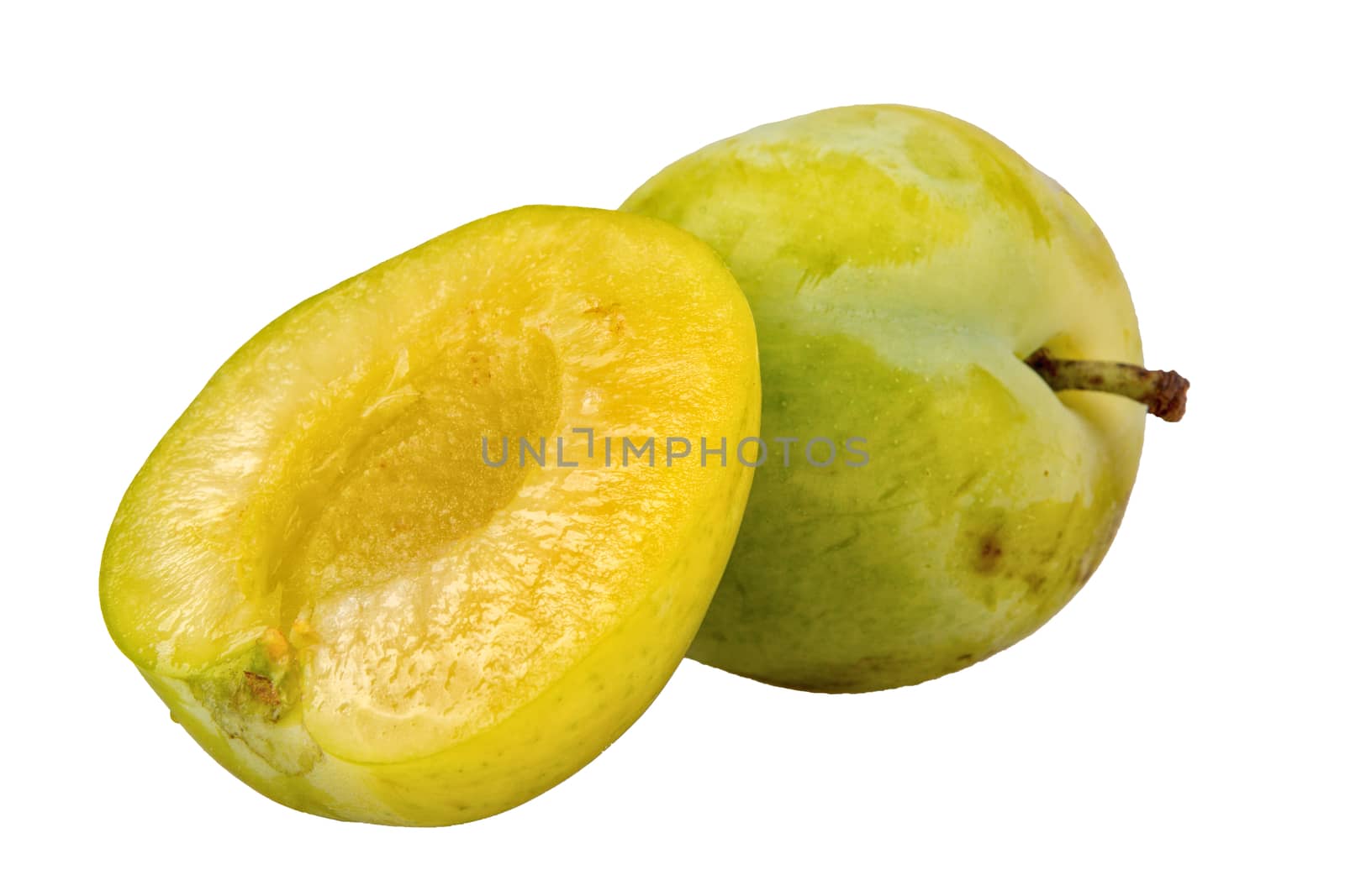 Greenish-yellow plums isolated on a white background