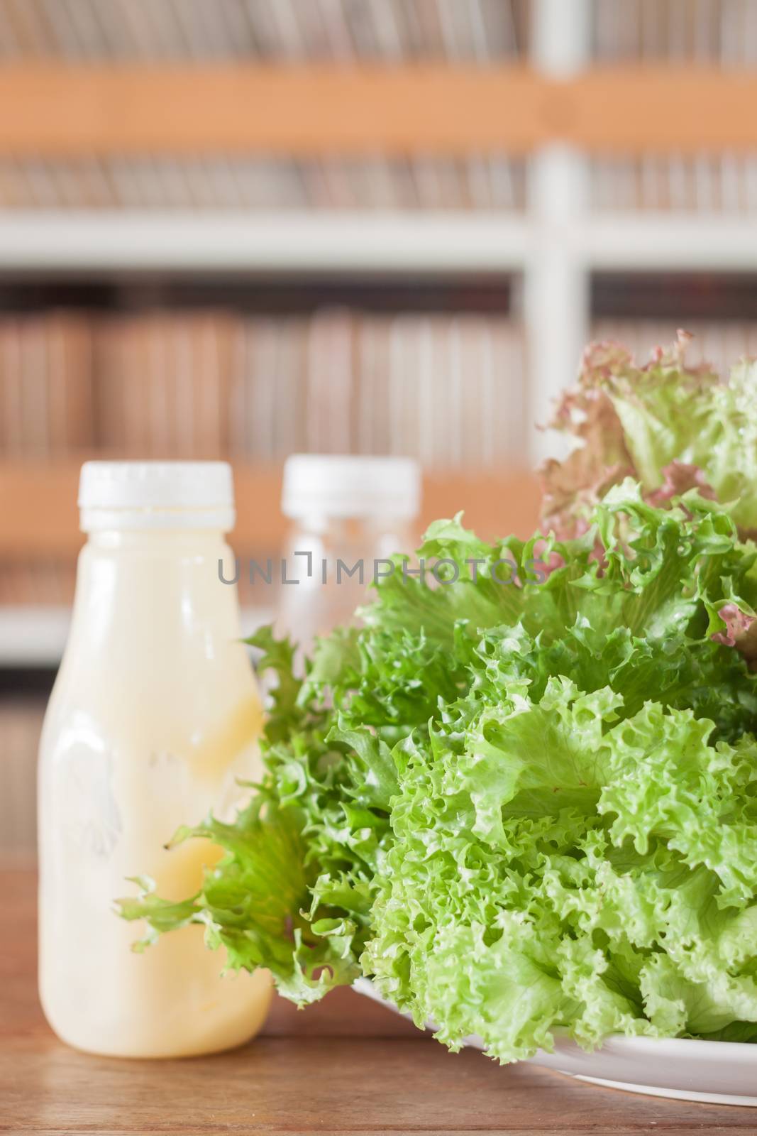 Fresh hydroponic vegetables on wooden table by punsayaporn