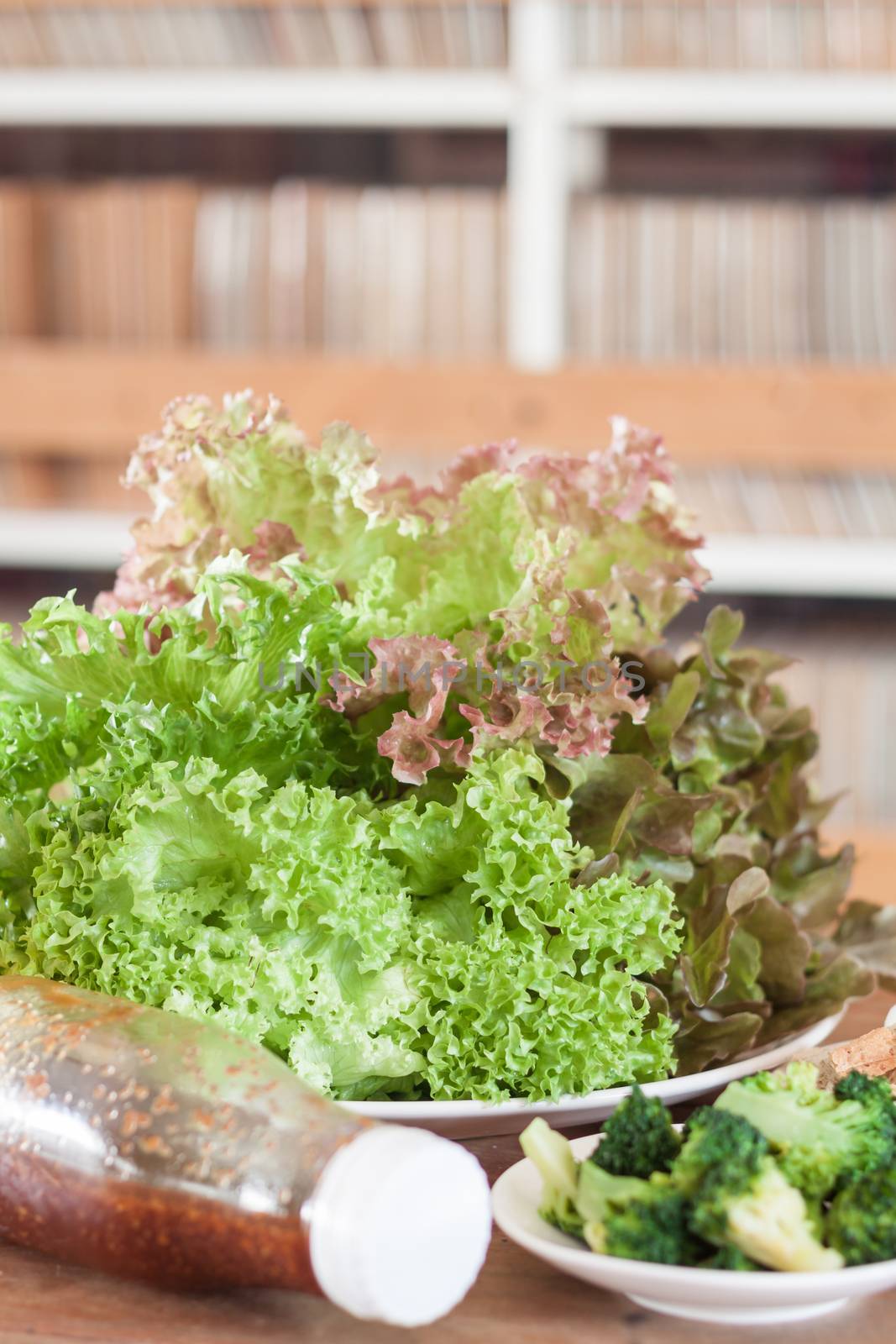 Fresh hydroponic vegetables on wooden table by punsayaporn