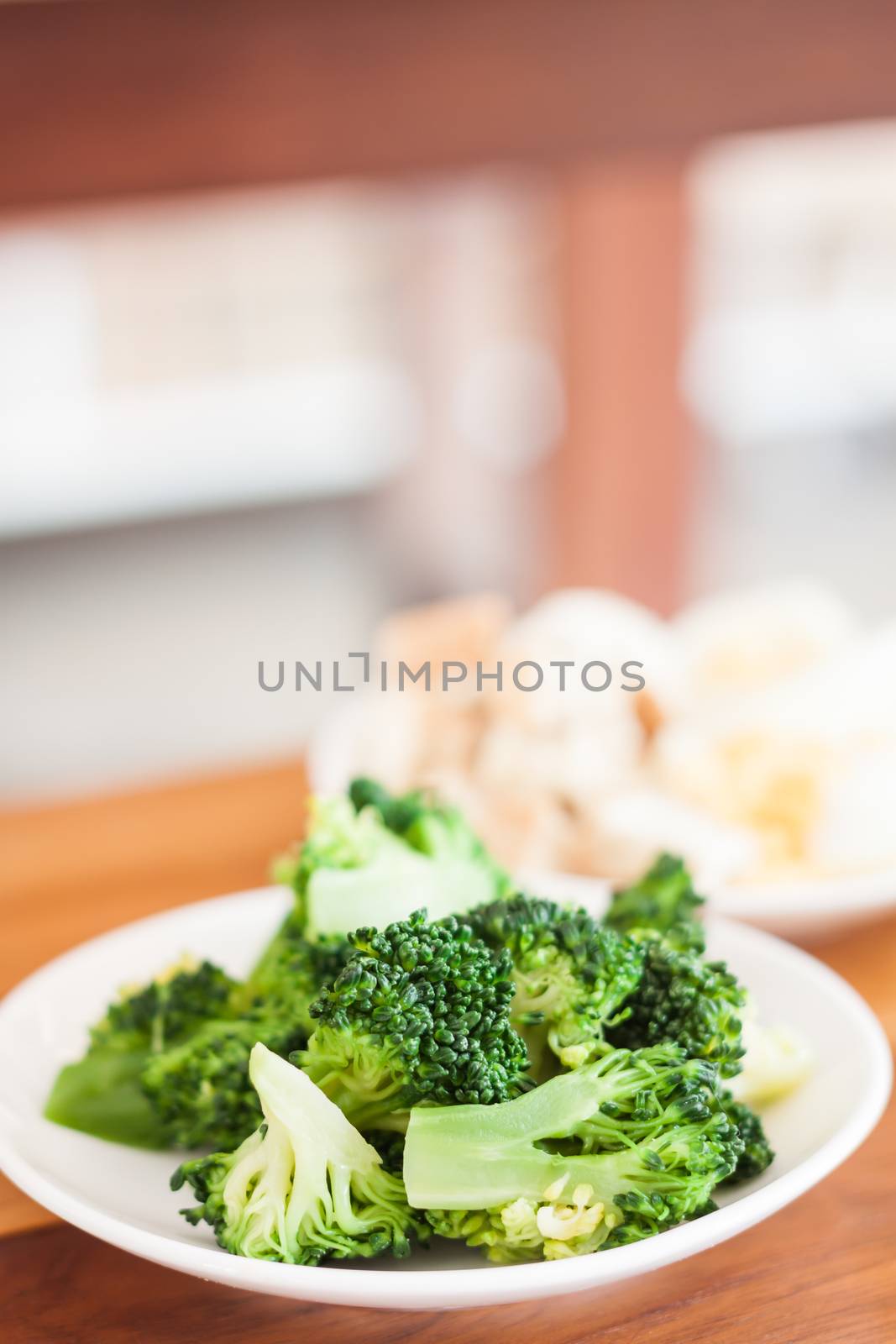 Fresh hydroponic vegetables on wooden table by punsayaporn