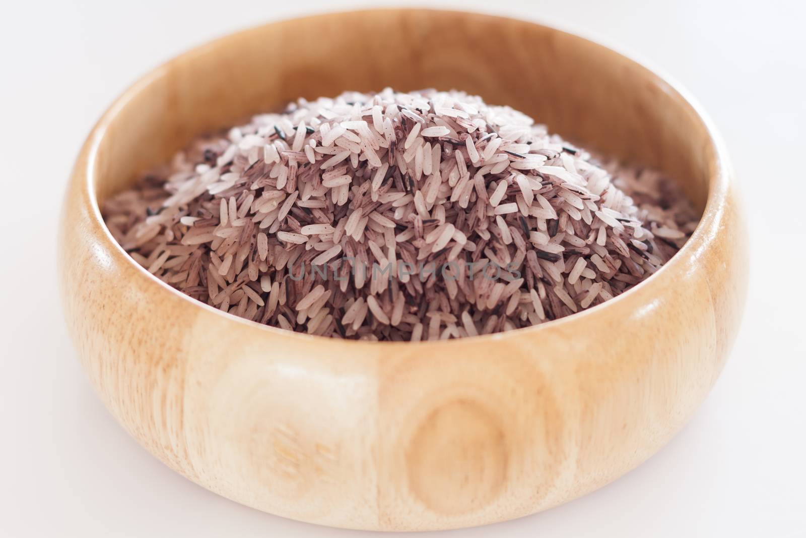 Berry rice in wooden bowl, stock photo