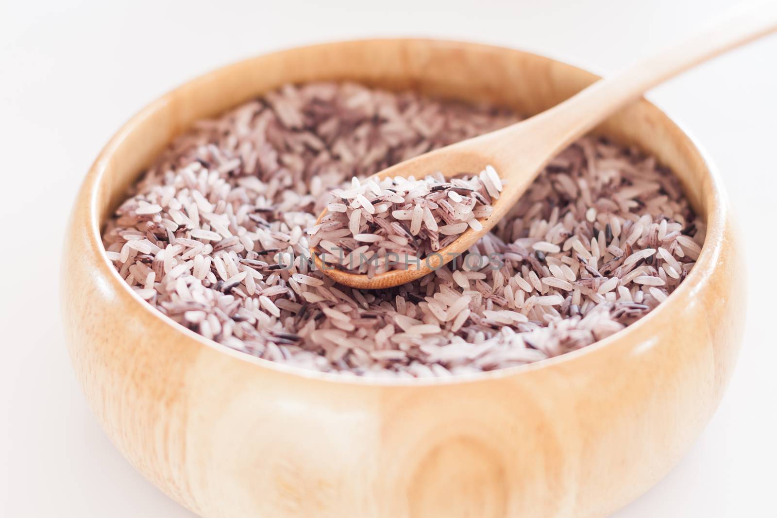Berry rice in wooden bowl, stock photo