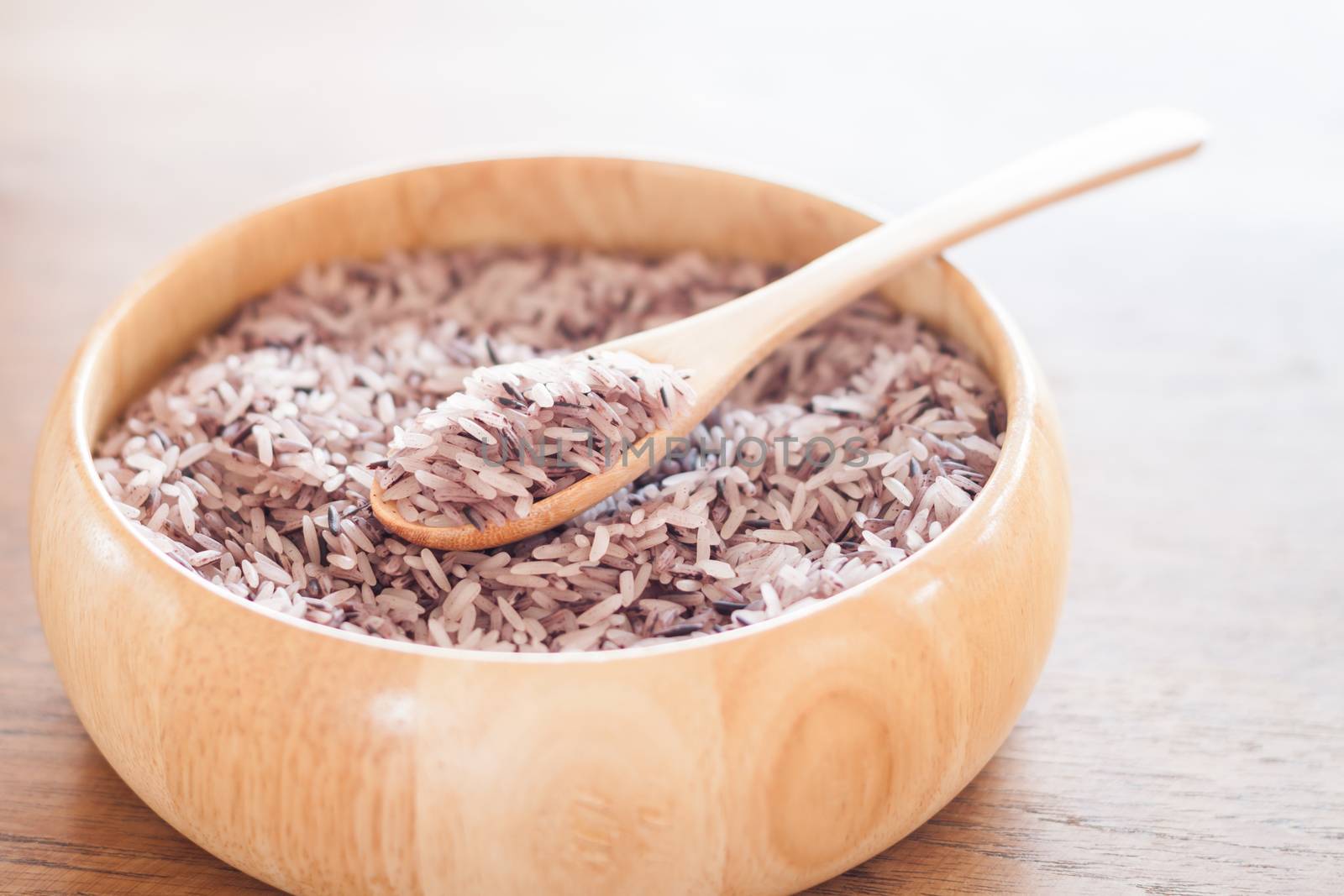 Berry rice in wooden bowl, stock photo