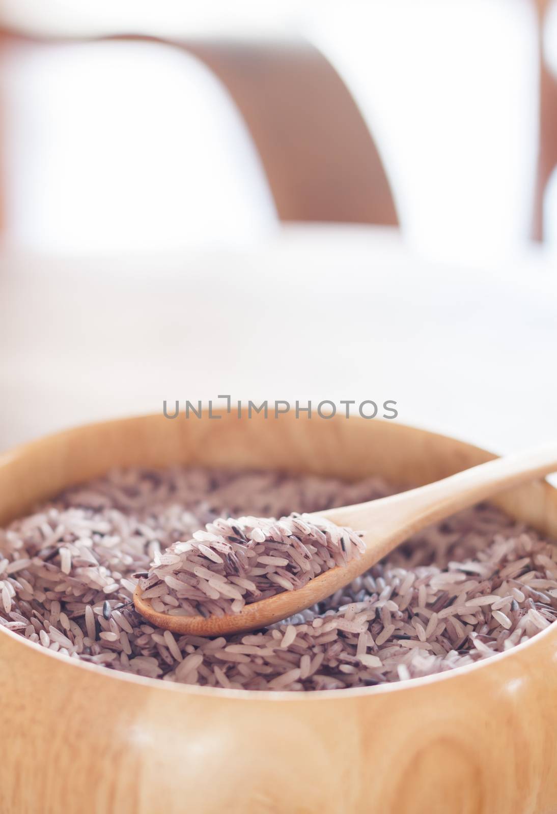 Berry rice in wooden bowl by punsayaporn