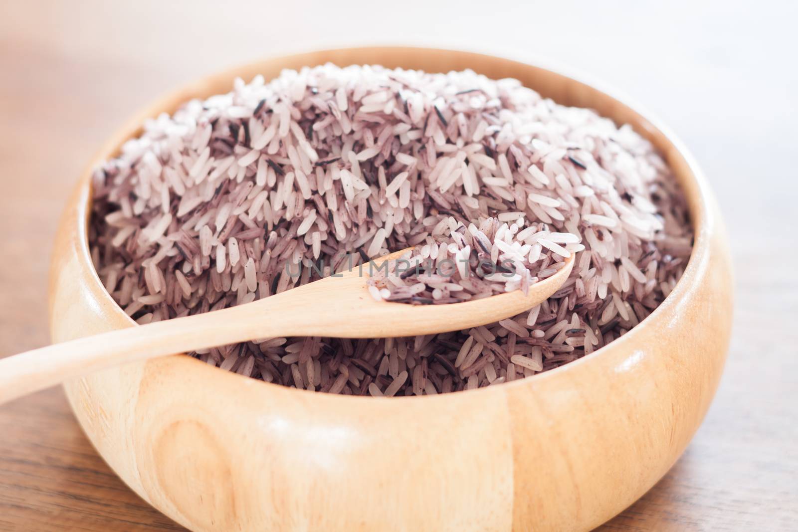 Berry rice in wooden bowl, stock photo