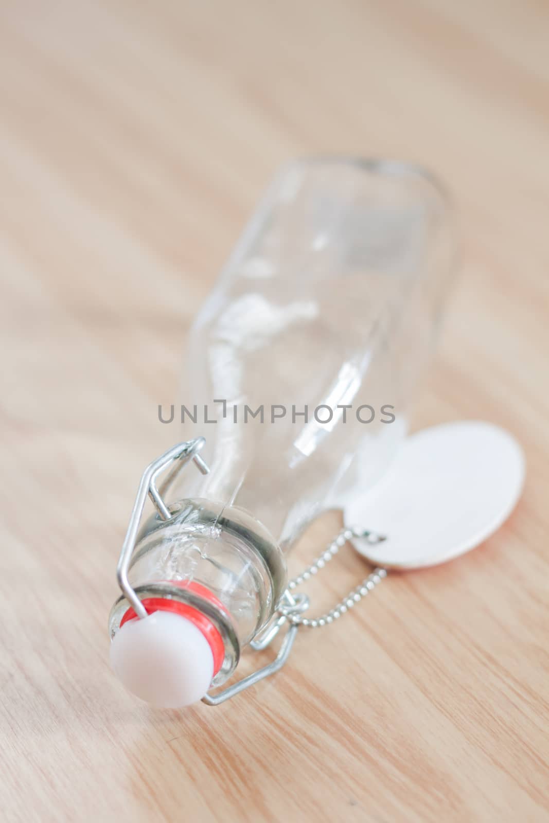 Vintage water bottle on wooden background, stock photo