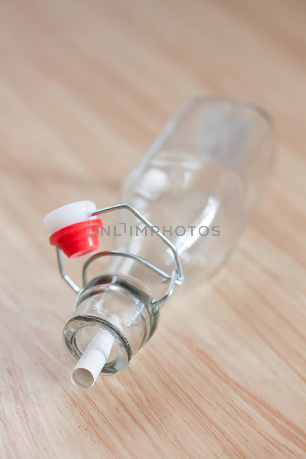 Vintage water bottle on wooden background, stock photo