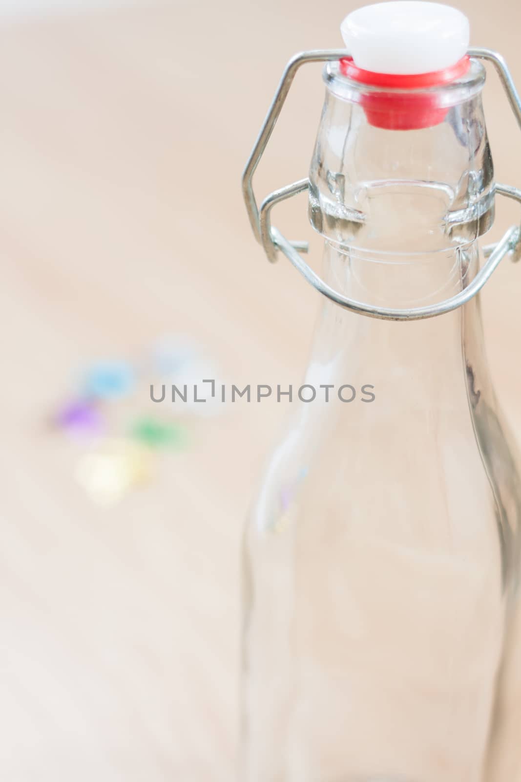 Vintage water bottle on wooden background, stock photo