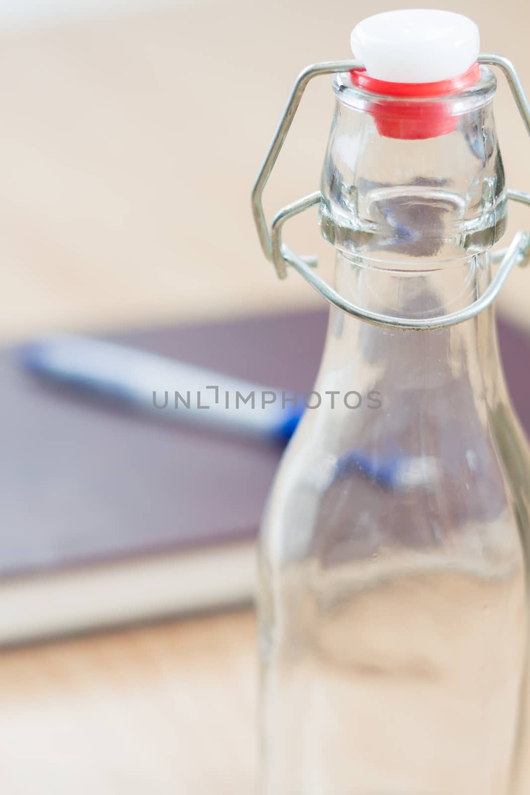 Vintage water bottle on wooden background, stock photo