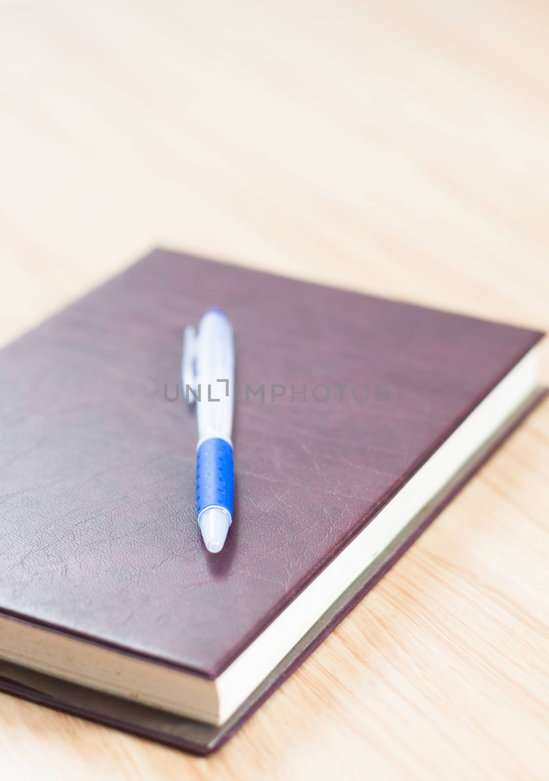 Classic leather notebook with pen, stock photo