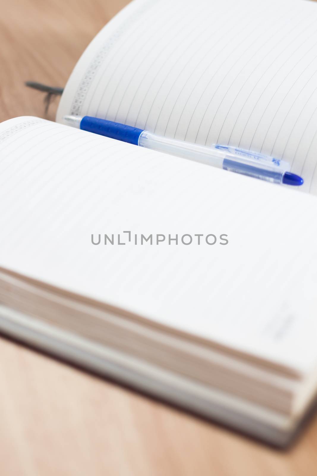 Classic leather notebook with pen, stock photo