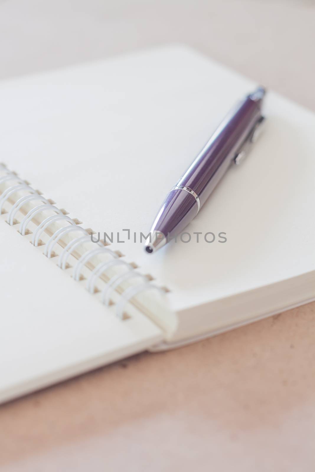 Closeup pen with spiral notebook, stock photo