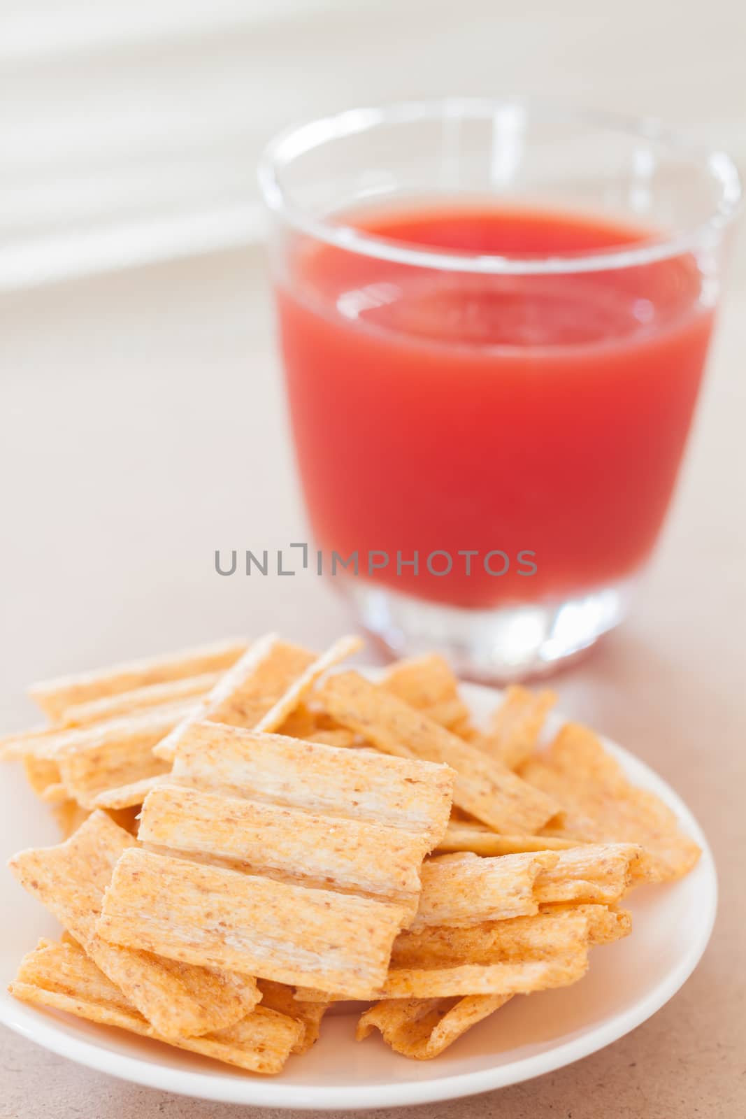 Snack on white plate with fruit punch by punsayaporn