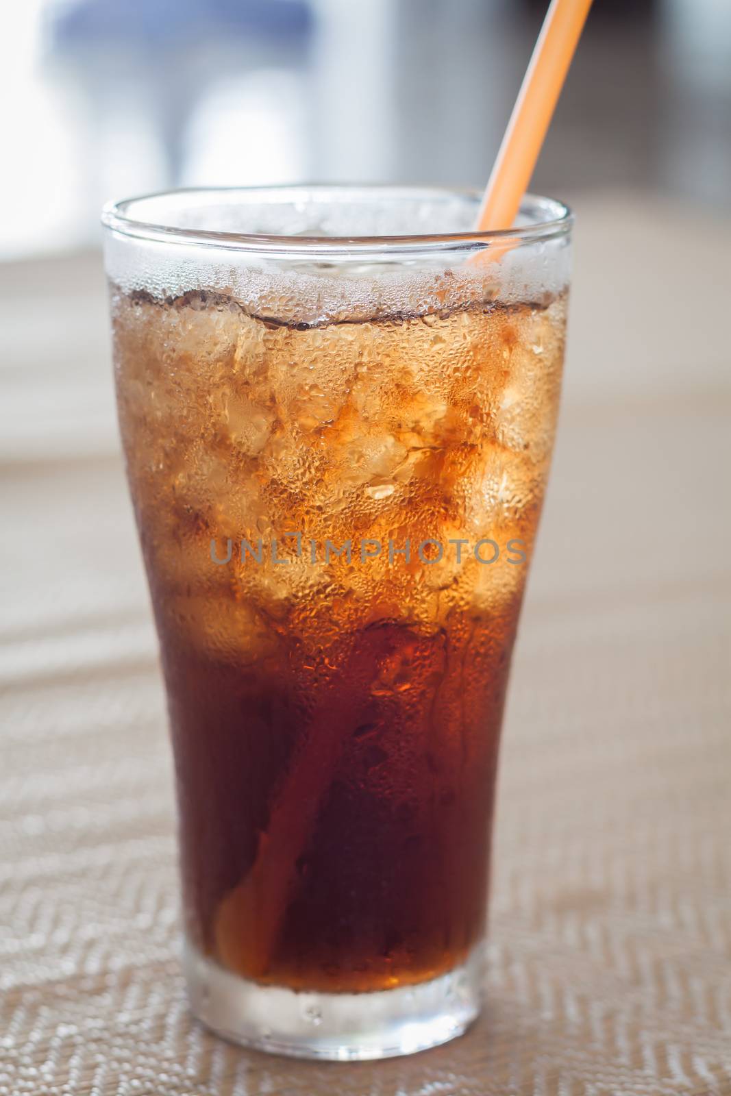 A glass of cola with ice, stock photo