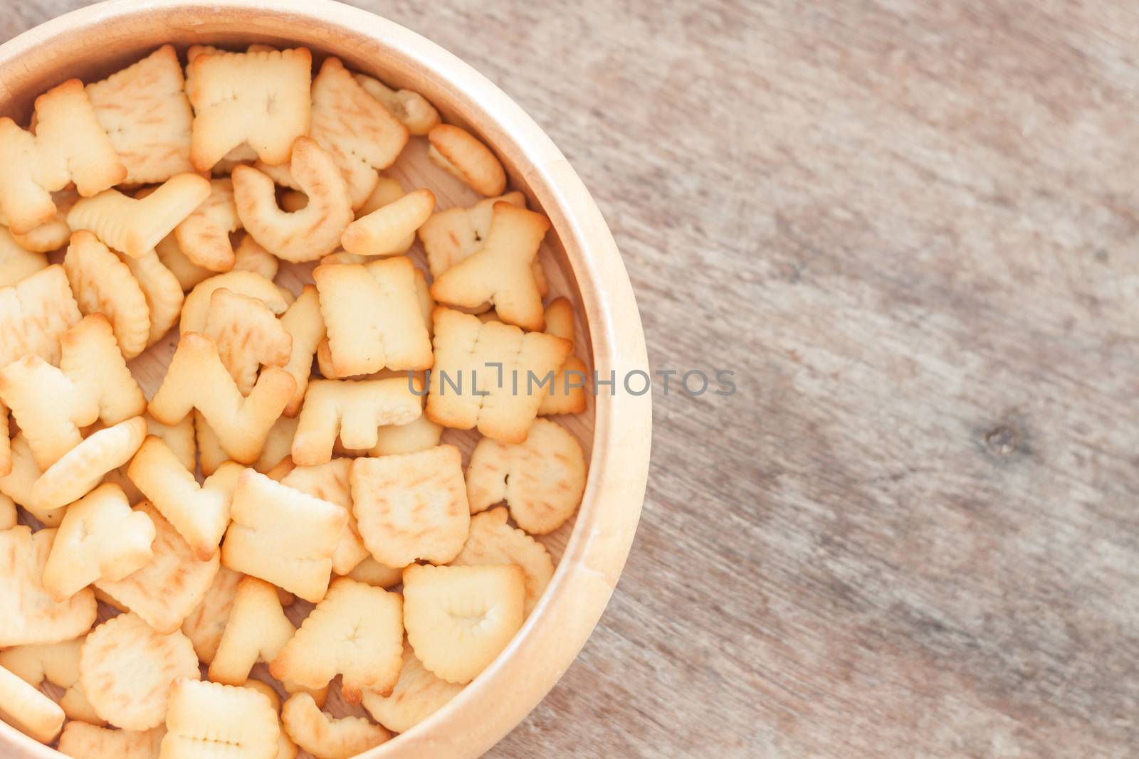 Alphabet biscuit in wooden tray, stock photo