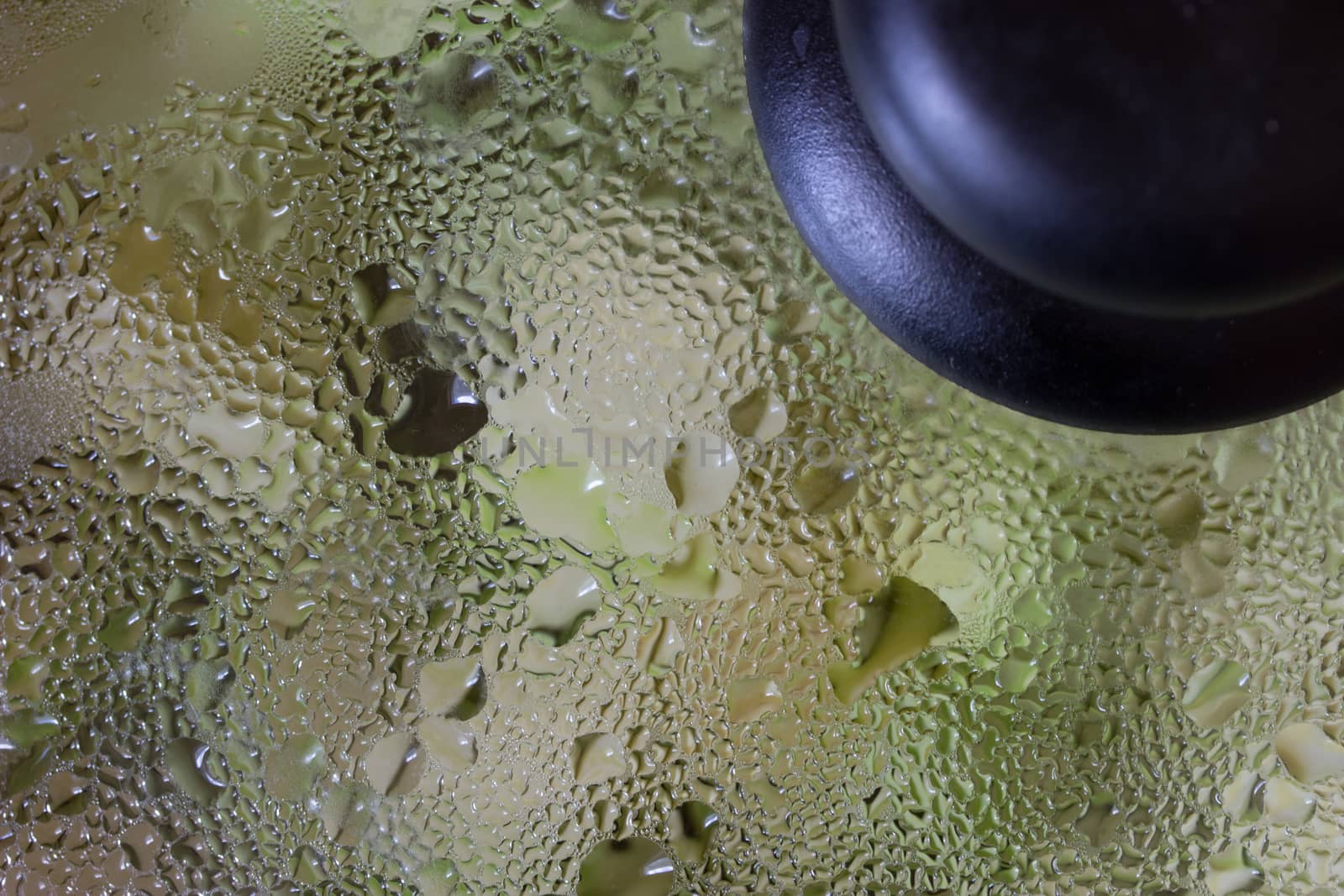 Close up of frying pan lid with water drops