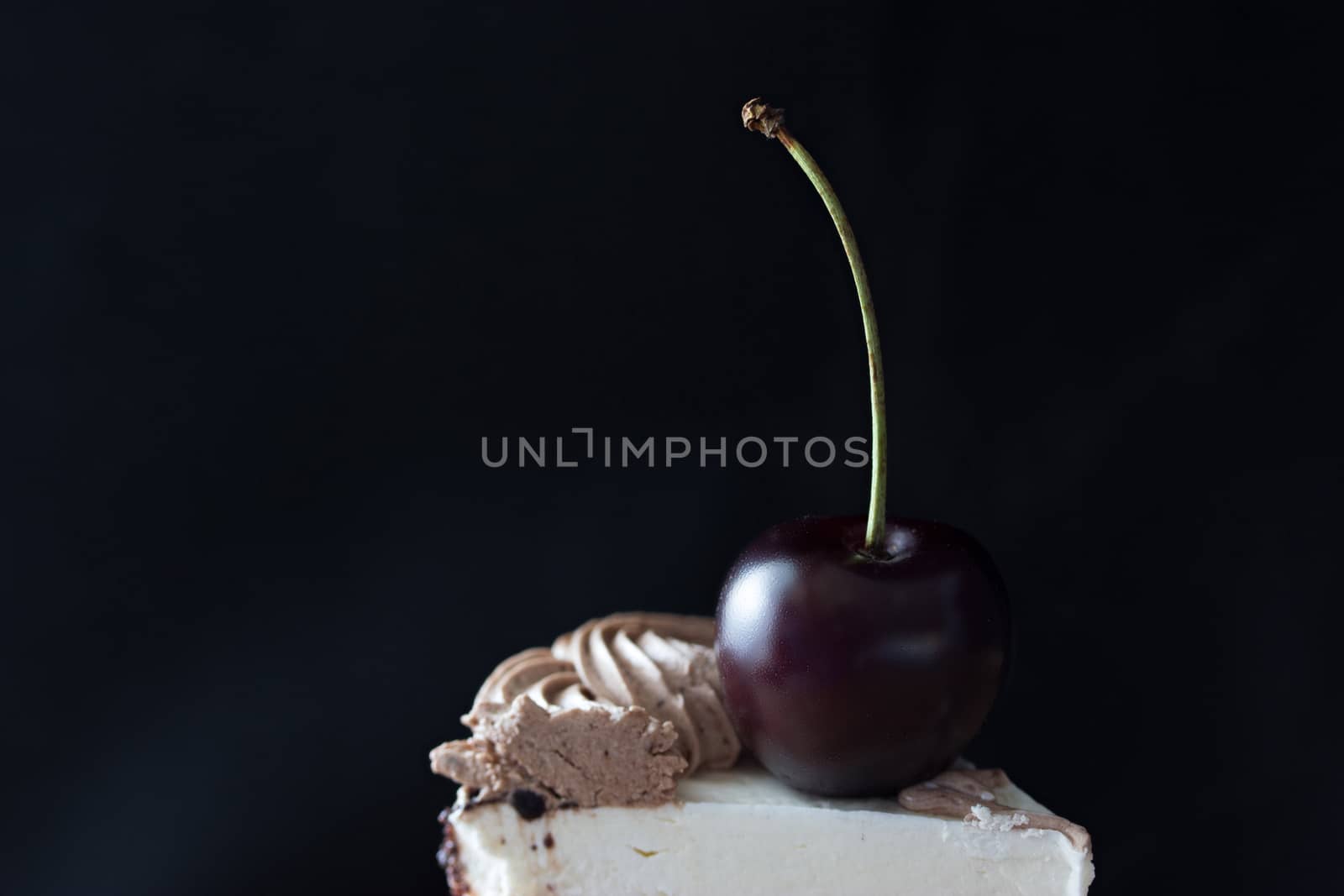 slice of cake with cherry on top, dark colours, toned