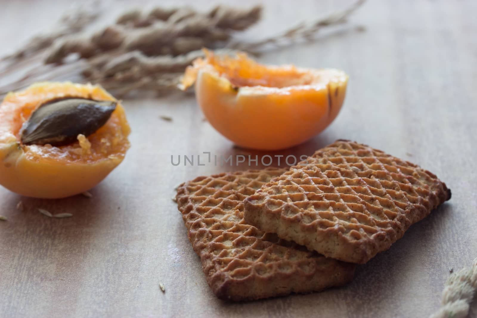 cookies apricots and ears on wooden table