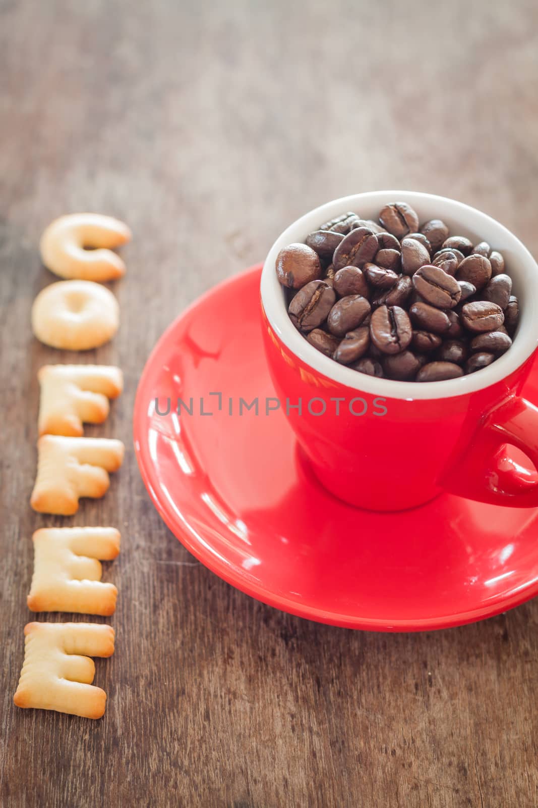 Coffee alphabet biscuit with red coffee cup, stock photo