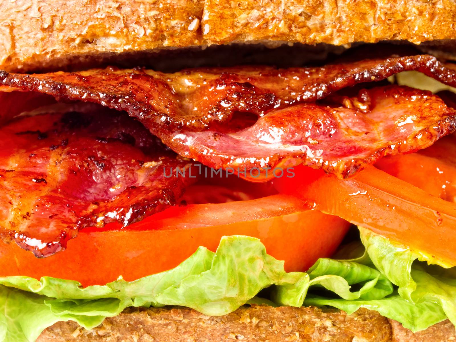 close up of juicy bacon lettuce and tomato sandwich