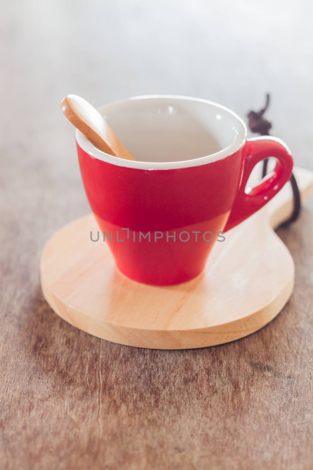 Red mug with wooden plate, stock photo