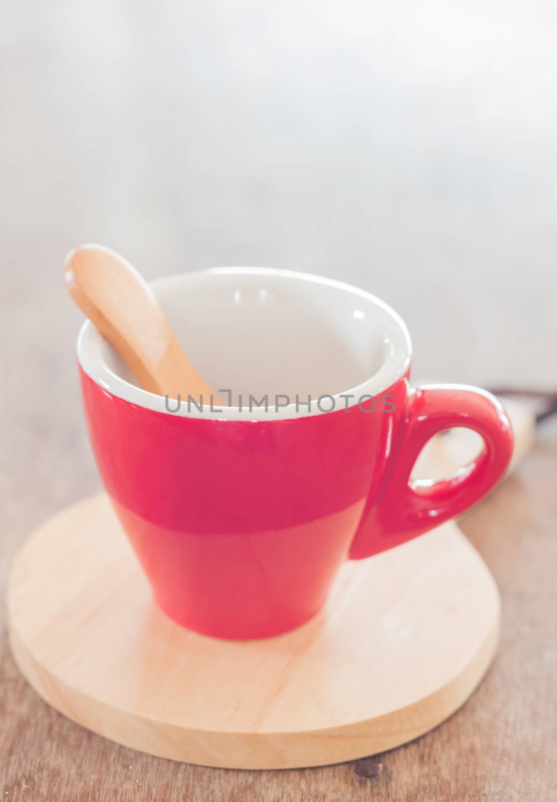 Red mug with wooden plate, stock photo