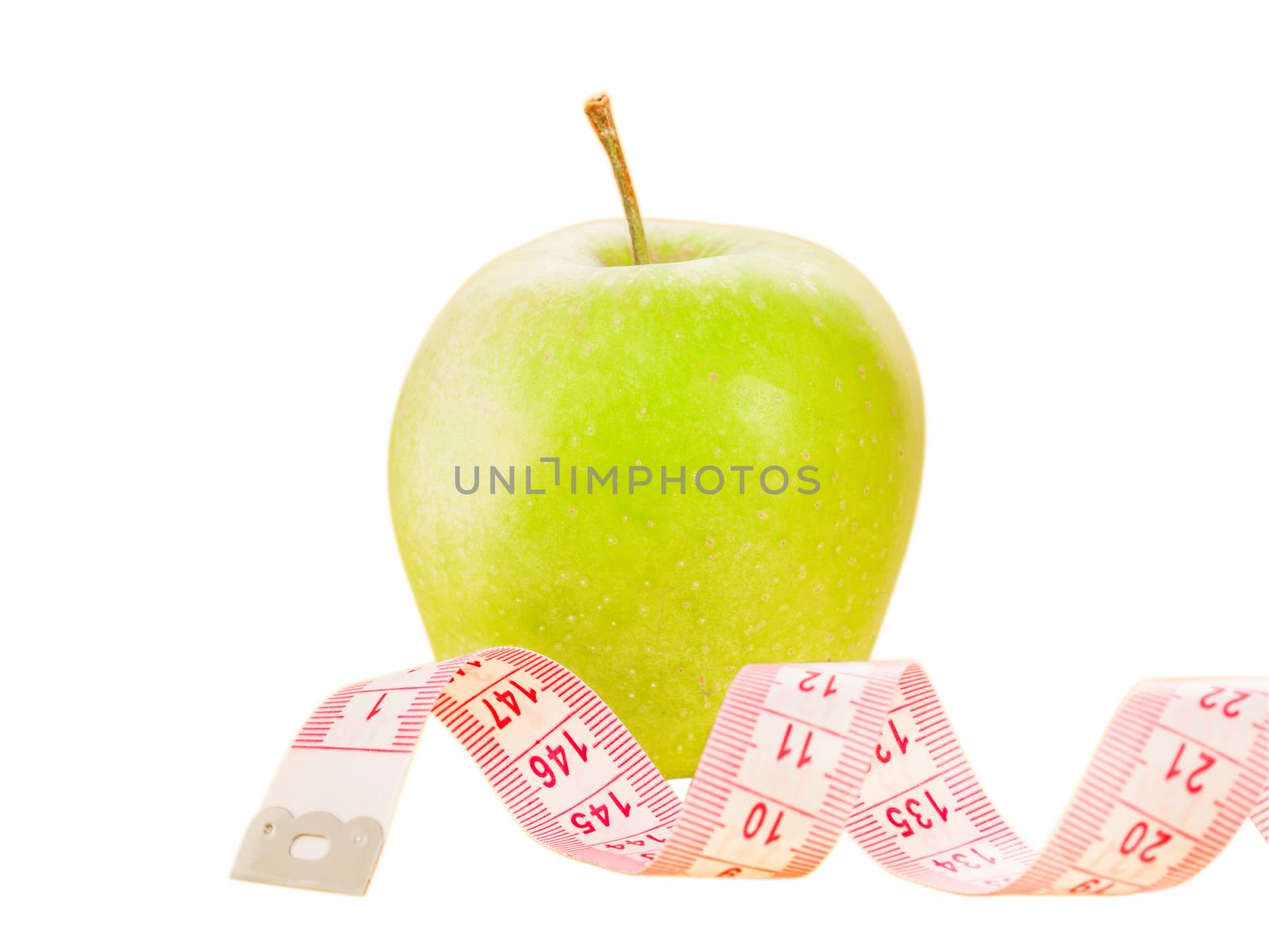 Measuring tape and green apple as a symbol of diet by fascinadora