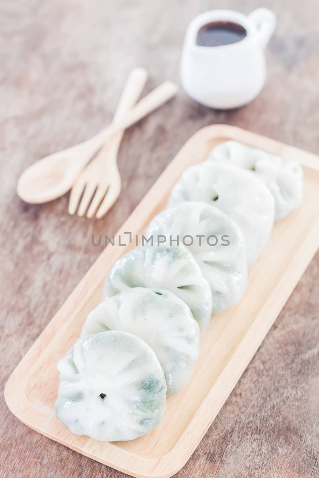 Chinese leek steamed dessert on wooden table by punsayaporn