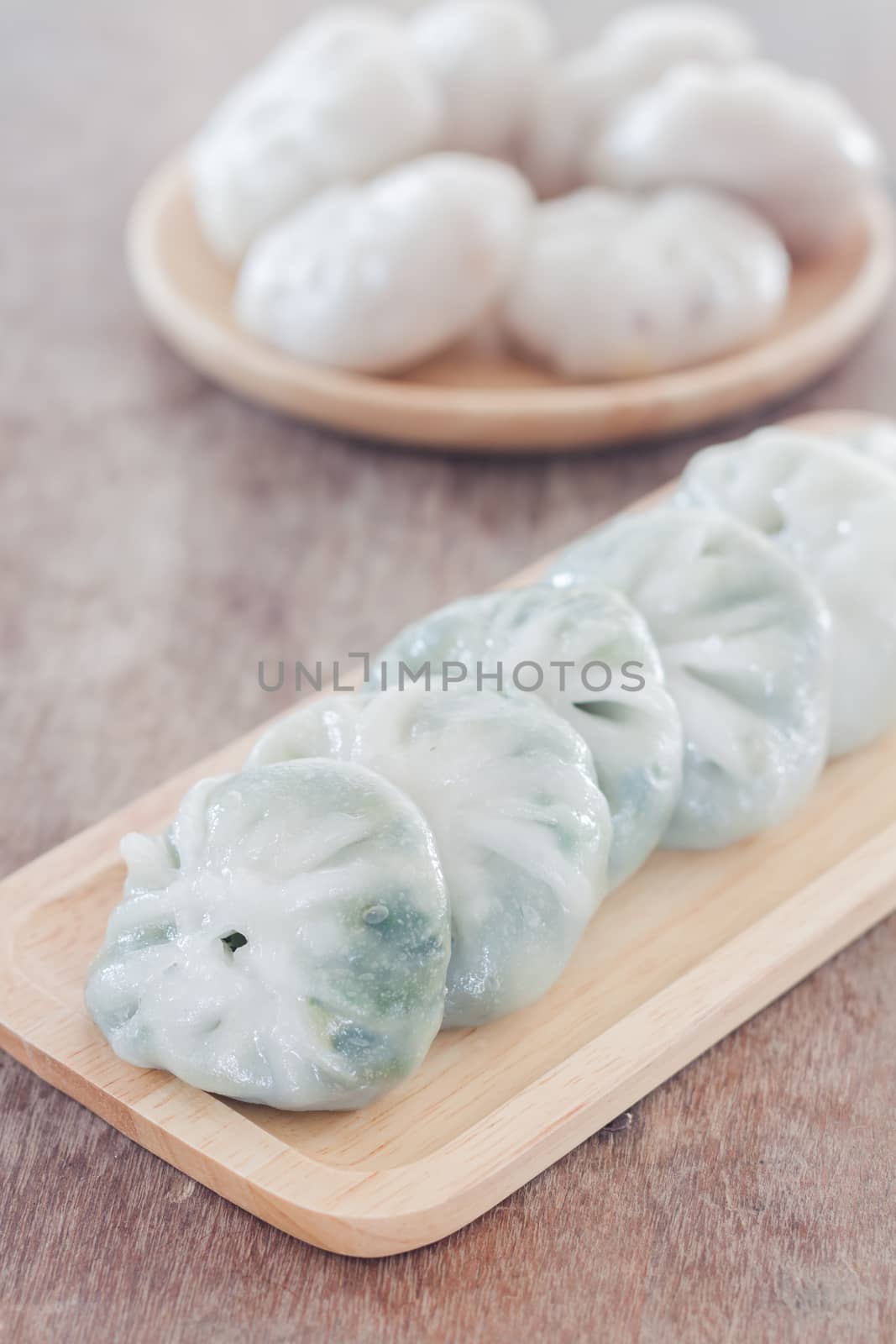 Chinese leek steamed dessert on wooden table by punsayaporn