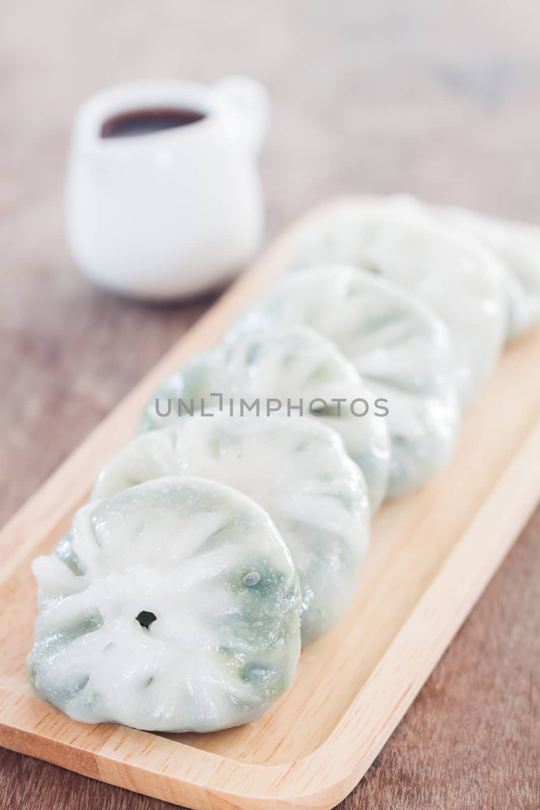 Chinese leek steamed dessert on wooden table by punsayaporn