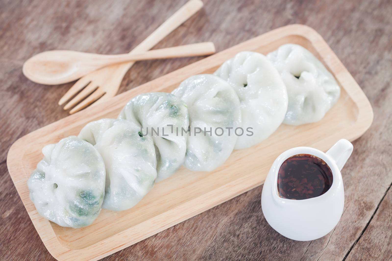 Chinese leek steamed dessert on wooden table, stock photo