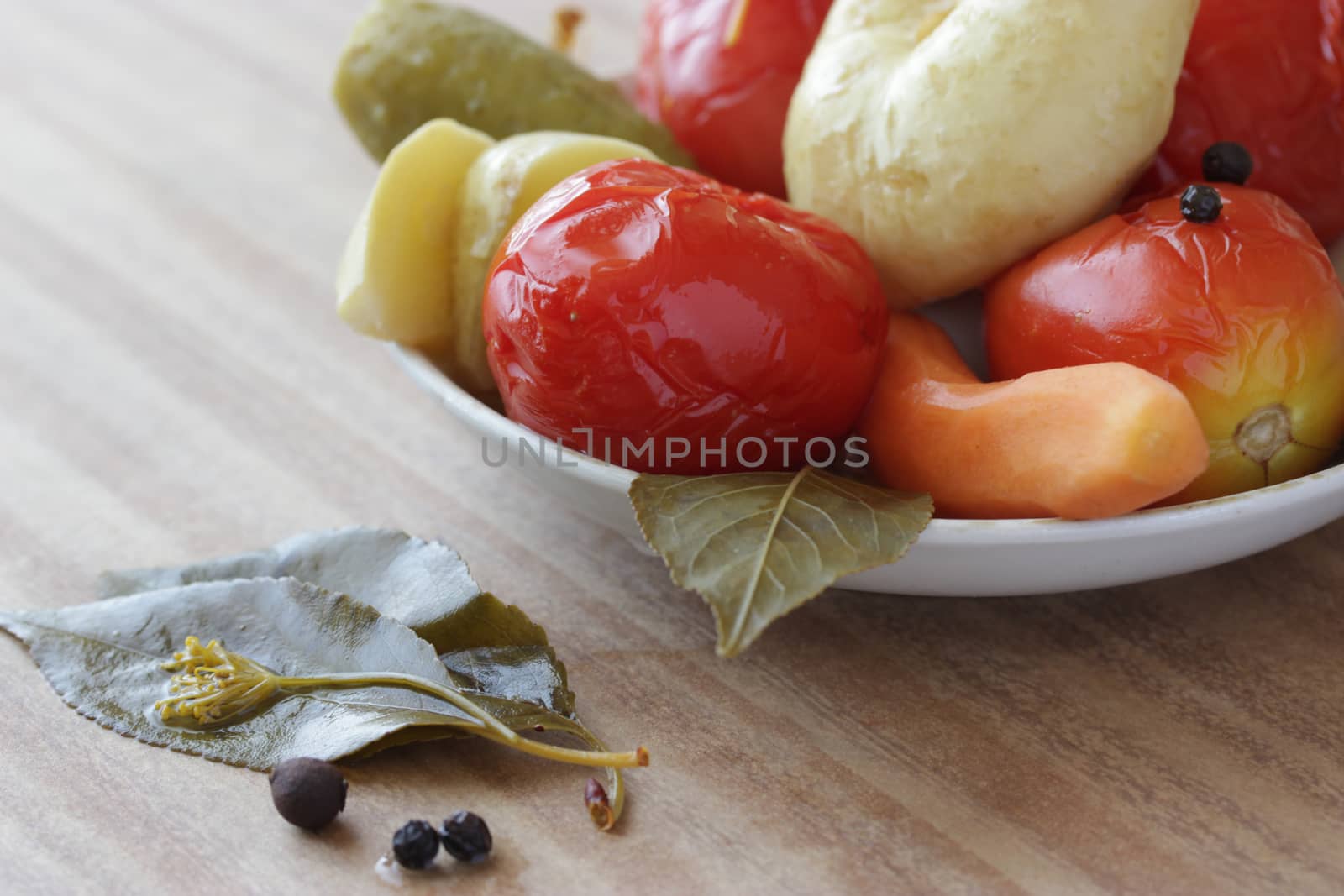 plate of pickled vegetable on wooden table