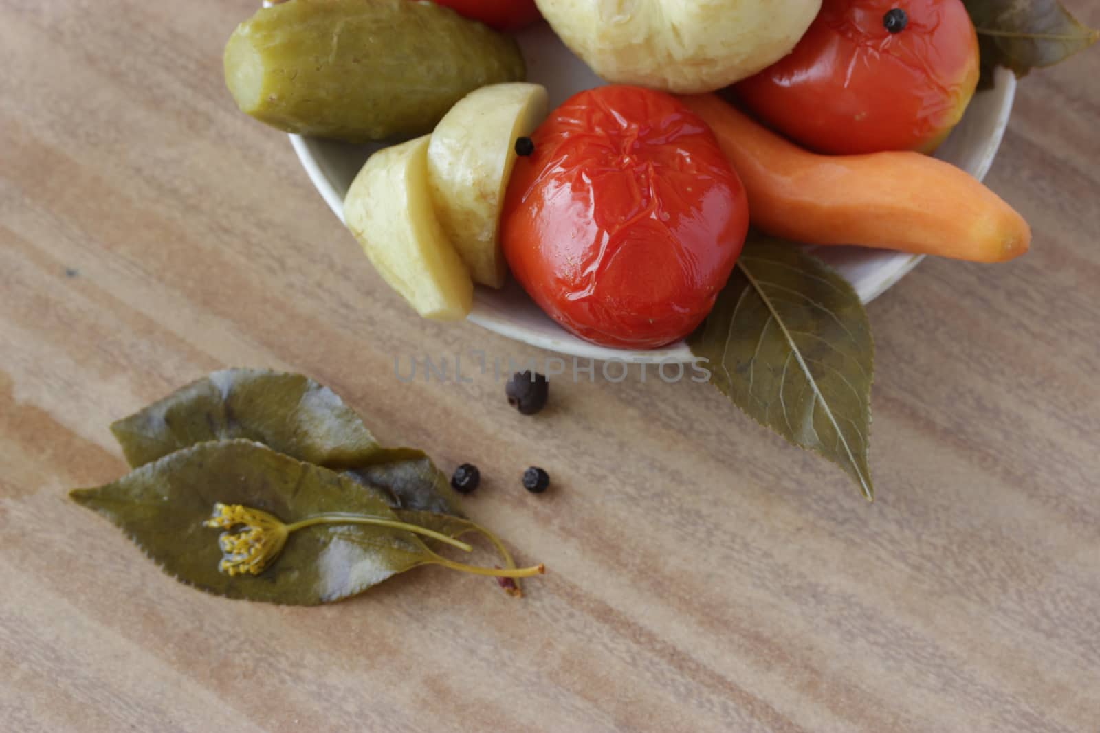 plate of pickled vegetable on wooden table
