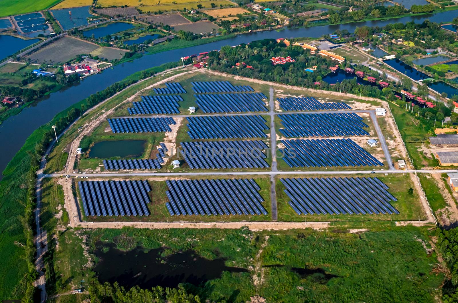 Solar farm solar panels aerial photo from the air outside the Bangkok Thailand