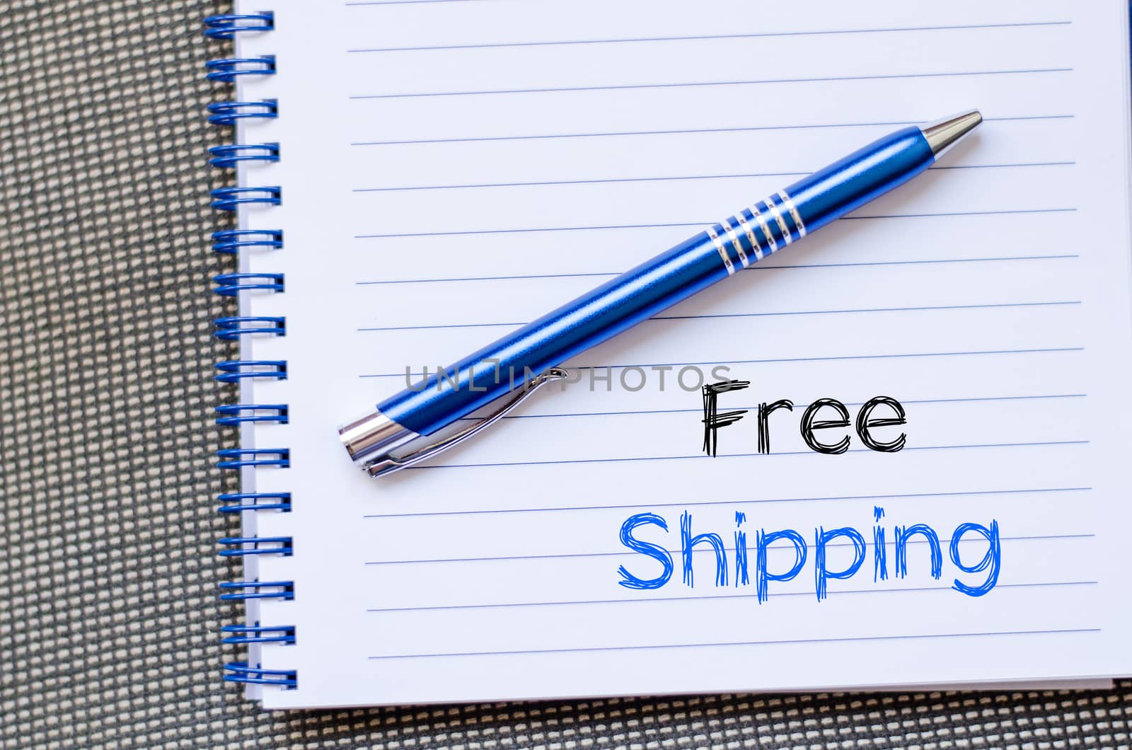 Free shipping text concept write on notebook